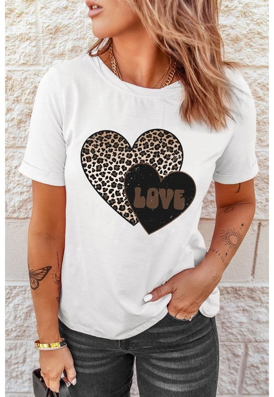 Our styles are designed with a trendy fitted look in mind following an international size standard. For the best fit we suggest choosing one size up from your usual. Be sure to check our sizing chart to find your perfect match!
  White Leopard LOVE Double Heart Printed Valentines Graphic Tee
  Large leopard heart and small letter
  printed heart design
  Cotton
  blend fabric for a soft and lightweight feel
  Simple yet chic design suitable for all ages
  Perfect for adding a playful touch to your Valentines Day outfit
Material: 62% Polyester 32% Cotton 6% Elastane