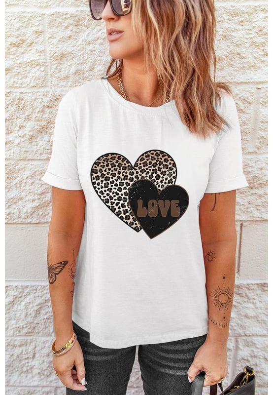 Our styles are designed with a trendy fitted look in mind following an international size standard. For the best fit we suggest choosing one size up from your usual. Be sure to check our sizing chart to find your perfect match!
  White Leopard LOVE Double Heart Printed Valentines Graphic Tee
  Large leopard heart and small letter
  printed heart design
  Cotton
  blend fabric for a soft and lightweight feel
  Simple yet chic design suitable for all ages
  Perfect for adding a playful touch to your Valentines Day outfit
Material: 62% Polyester 32% Cotton 6% Elastane