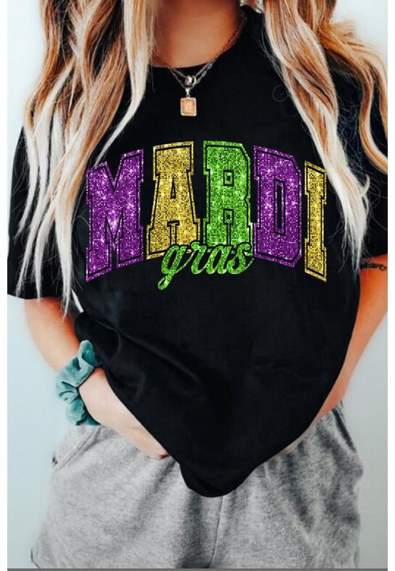 Our styles are designed with a trendy fitted look in mind following an international size standard. For the best fit we suggest choosing one size up from your usual. Be sure to check our sizing chart to find your perfect match!
  Black Mardi Gras Heat Transfer Graphic Holiday Tee
  Ideal for celebrating the carnival season
  Features iconic Mardi Gras elements
  Glittering heat
  transfer pattern adds a touch of sparkle
  Pairs well with jeans or shorts for a stylish outfit
  Easy to customize with various designs
Material: 62% Polyester 32% Cotton 6% Elastane