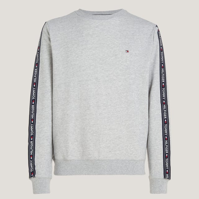 Men's Tommy Hilfiger Logo Tape Lounge Sweatshirt in Grey Ribbed crewneck.Ribbed cuffs and hem.TH logo stripes on the sleeves.Tommy Hilfiger flag embroidery on the chest.Regular fit.