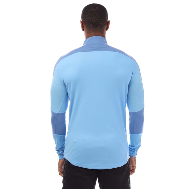 Mens Puma Final Training ¼ Zip Top in blue.- ¼ zip front.- Long sleeves.- Bold PUMA logo on the front.- Engineered fabric for breathability and graphical contrast on shoulders and arm.- Dropped back hem. - DRYCELL keeps you dry and cool.- Light  breathable material.- 87% Polyamide  13% Elastane.- Ref: 65647518M18