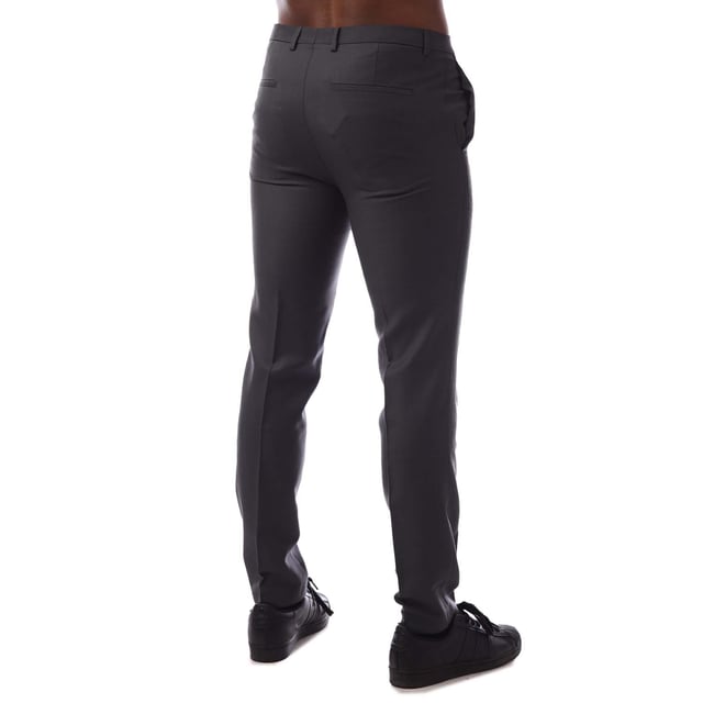 Hugo Boss Hesten204 Trousers in grey.- Hook eye and zip fastening.- Belt loops.- Side pockets.- Slim fit.- 74% Virgin Wool  18% Polyester (Recycled)  8% Polyamide.- Ref: 50440880033
