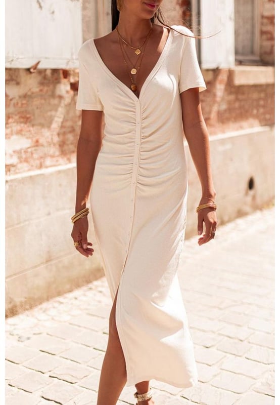 Chic and flattering pencil style
  Streamline tailored design
  V neck front and low scoop back
  Buttons front and ruched design
  Longline silhouette with slit
  High elasticity
  Detailed size chart provided
Material: 93% Viscose 7% Elastane