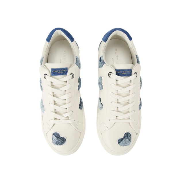 The
Lane Love sneaker is crafted from a white leather with denim cut out hearts
across the upper. There are two blue suede patches on the tongue and heel with
gold foil branding.