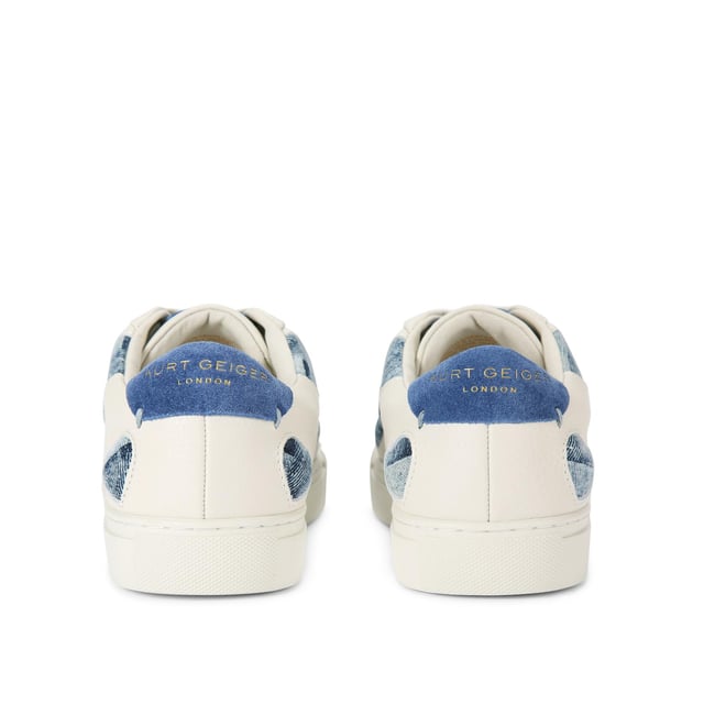 The
Lane Love sneaker is crafted from a white leather with denim cut out hearts
across the upper. There are two blue suede patches on the tongue and heel with
gold foil branding.