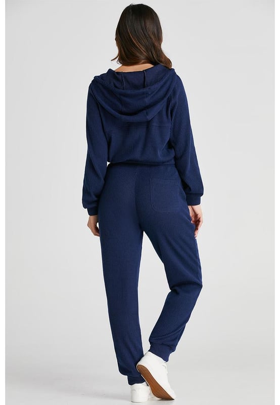 Our styles are designed with a trendy fitted look in mind following an international size standard. For the best fit we suggest choosing one size up from your usual. Be sure to check our sizing chart to find your perfect match!
  Navy blue ribbed knit cropped hoodie and drawstring joggers set
  Coordinated outfit for a stylish look
  Trendy ribbed
  knit design for a textured appearance
  Adjustable drawstring on the waist for a customized fit
  Crafted from quality fabric for ultra comfort during workouts
  Suitable for both workouts and casual wear
Material: 95% Polyester 5% Elastane