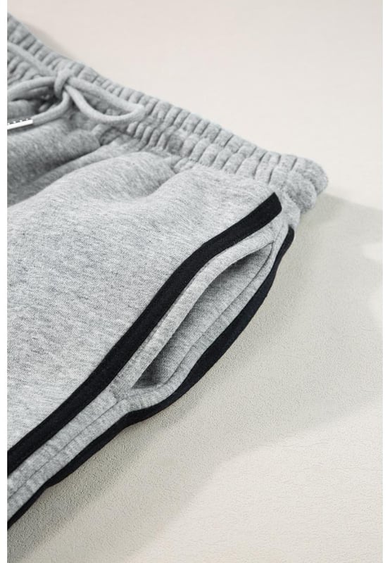 Our styles are designed with a trendy fitted look in mind following an international size standard. For the best fit we suggest choosing one size up from your usual. Be sure to check our sizing chart to find your perfect match!
  Light Grey Solid Color Side Striped Sweatshirt Active Set
  Two
  piece set for a coordinated look
  Solid color for a sleek and versatile appearance
  Side stripes enhance the sporty aesthetic
  Comfortable and active wear sweatshirt
  Available in various sizes to suit different body types
Material: 50% Polyester 50% Cotton