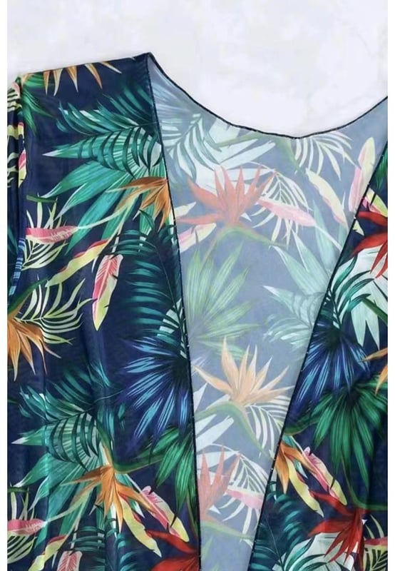 Three
  piece ensemble for versatile looks
  Lively and colorful tropical print
  Contrast trim detailing adds a stylish and modern element
  Halter neck design provides lift and support for the bust
  Available in various sizes according to the size chart provided
Material: 100% Polyester