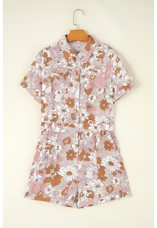 Our styles are designed with a trendy fitted look in mind following an international size standard. For the best fit we suggest choosing one size up from your usual. Be sure to check our sizing chart to find your perfect match!
  Pink floral short sleeve collared button front romper
  Perfect for summer days with a playful flower print
  Short cuffed sleeves and cuffed hem
  Collared neck and buttoned bodice
  Features chest pockets and pocketed shorts
  Elastic back waistline for a comfortable fit
Material: 100% Polyester