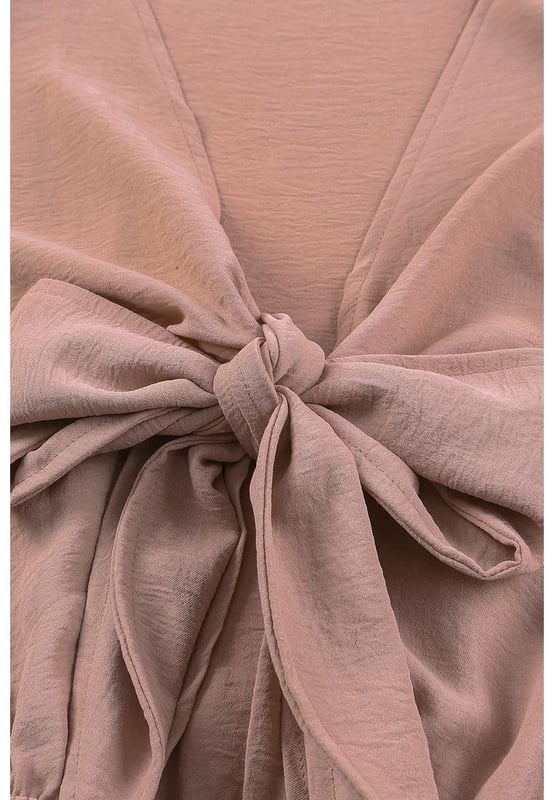Romper de color sólido adecuado para el uso diario  
Escote en V profundo con detalle de nudo  
Mangas abullonadas para un estilo elegante y dulce  
Diseño favorecedor que realza la forma del cuerpo  
Ideal para usar en casa, fiestas en la playa y compras  
Material: 100% Poliéster