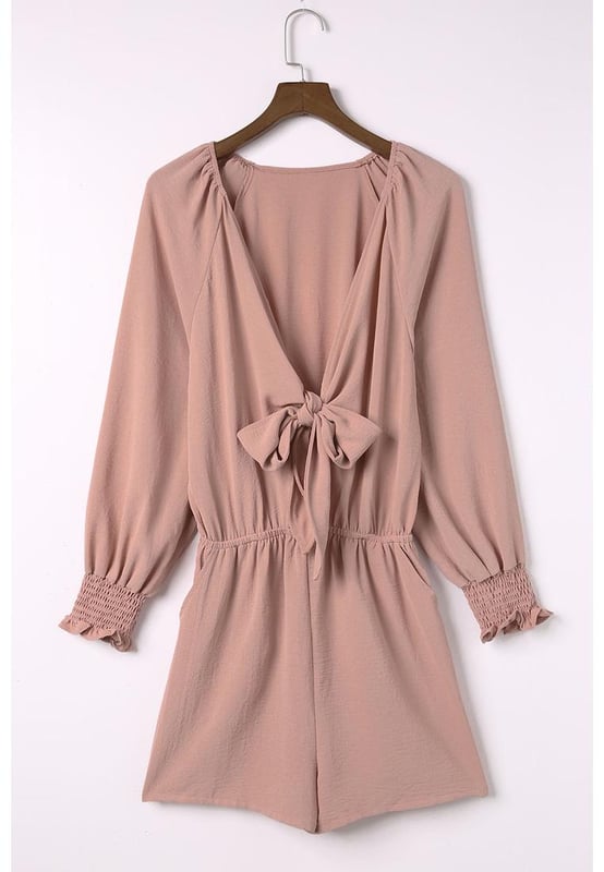 Romper de color sólido adecuado para el uso diario  
Escote en V profundo con detalle de nudo  
Mangas abullonadas para un estilo elegante y dulce  
Diseño favorecedor que realza la forma del cuerpo  
Ideal para usar en casa, fiestas en la playa y compras  
Material: 100% Poliéster