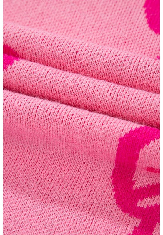 Feminine bow pattern
  Loose fit suitable for all body shapes
  Drop shoulder design for a laid
  back look
  Soft and warm knit material
  Ideal for cold winter season