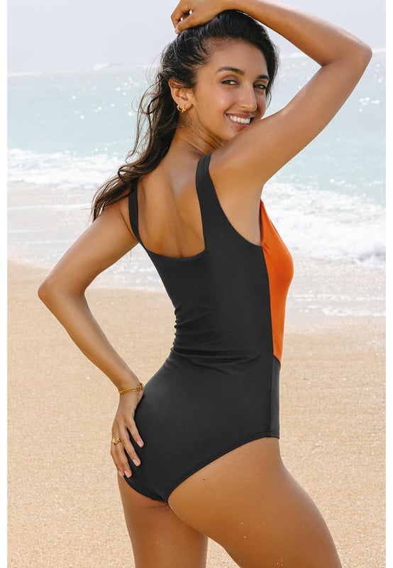 Our styles are designed with a trendy fitted look in mind following an international size standard. For the best fit we suggest choosing one size up from your usual. Be sure to check our sizing chart to find your perfect match!
  Colorblock silhouette for a stylish look
  Square neck design
  Removable bust pads for customizable support
  Full coverage for a flattering fit
  High elasticity for comfortable wear
Material: 82% Polyamide 18% Elastane