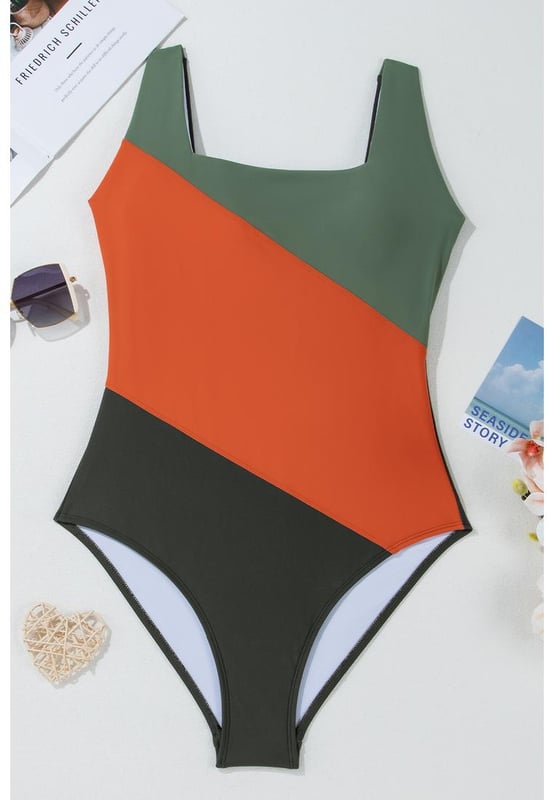 Our styles are designed with a trendy fitted look in mind following an international size standard. For the best fit we suggest choosing one size up from your usual. Be sure to check our sizing chart to find your perfect match!
  Colorblock silhouette for a stylish look
  Square neck design
  Removable bust pads for customizable support
  Full coverage for a flattering fit
  High elasticity for comfortable wear
Material: 82% Polyamide 18% Elastane