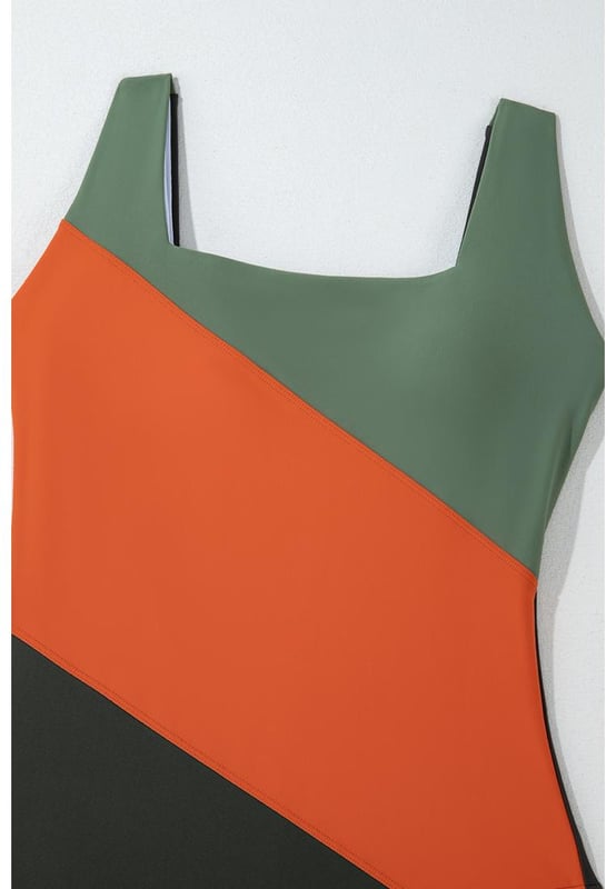 Our styles are designed with a trendy fitted look in mind following an international size standard. For the best fit we suggest choosing one size up from your usual. Be sure to check our sizing chart to find your perfect match!
  Colorblock silhouette for a stylish look
  Square neck design
  Removable bust pads for customizable support
  Full coverage for a flattering fit
  High elasticity for comfortable wear
Material: 82% Polyamide 18% Elastane