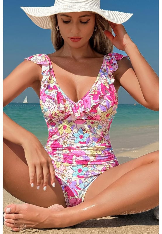 Our styles are designed with a trendy fitted look in mind following an international size standard. For the best fit we suggest choosing one size up from your usual. Be sure to check our sizing chart to find your perfect match!
  One
  piece swimsuit
  Pink floral design
  V neckline with ruffle details
  Lace
  up tie at the back
  Tummy control feature
  High stretch material
  Classic bum coverage