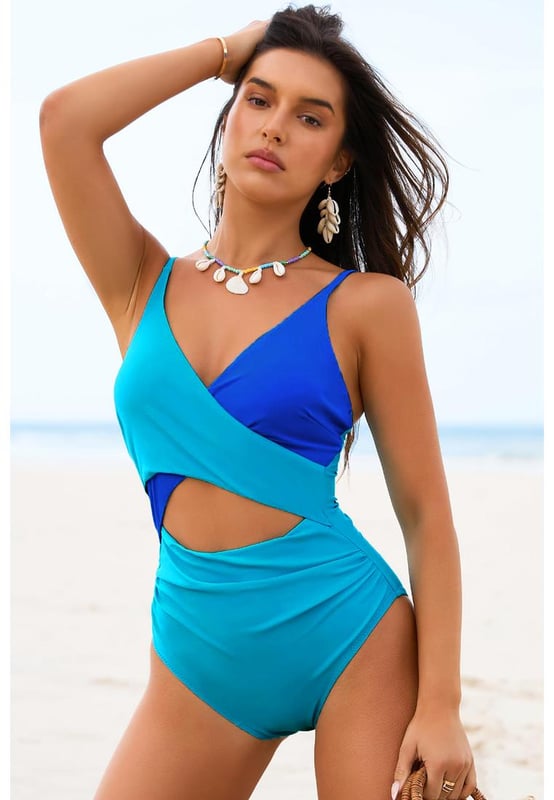 Our styles are designed with a trendy fitted look in mind following an international size standard. For the best fit we suggest choosing one size up from your usual. Be sure to check our sizing chart to find your perfect match!
  Light Blue Crossover Colorblock Cutout One Piece Swimsuit
  Chic color block design
  Crossover bust with cut
  out front
  Flattering fit to show sexy curves and long legs
  Adjustable spaghetti straps
  Open back for added sexiness
  High elasticity for a comfortable fit
Material: 82% Polyamide 18% Elastane