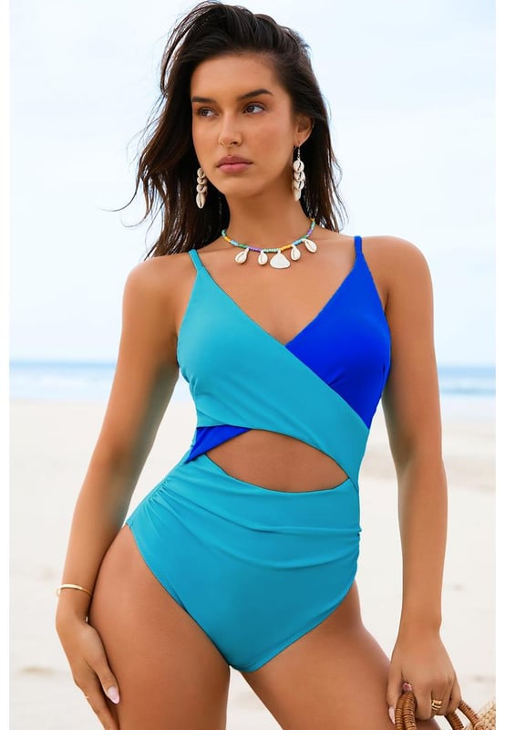 Our styles are designed with a trendy fitted look in mind following an international size standard. For the best fit we suggest choosing one size up from your usual. Be sure to check our sizing chart to find your perfect match!
  Light Blue Crossover Colorblock Cutout One Piece Swimsuit
  Chic color block design
  Crossover bust with cut
  out front
  Flattering fit to show sexy curves and long legs
  Adjustable spaghetti straps
  Open back for added sexiness
  High elasticity for a comfortable fit
Material: 82% Polyamide 18% Elastane