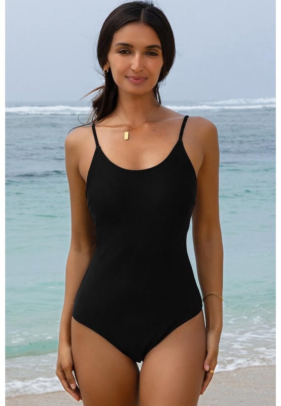 Our styles are designed with a trendy fitted look in mind following an international size standard. For the best fit we suggest choosing one size up from your usual. Be sure to check our sizing chart to find your perfect match!
  Black thin strap strappy lace
  up open back one
  piece swimsuit
  Delicate spaghetti straps for a feminine and elegant touch
  Lace
  up open back detail
  Solid color choice for a chic and versatile option
  High elasticity for a comfortable fit
Material: 82% Polyamide 18% Elastane
