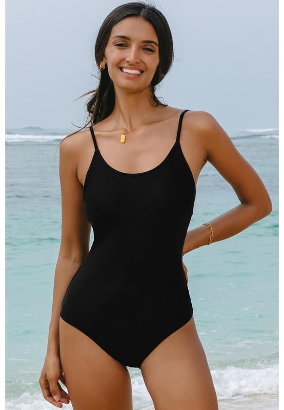 Our styles are designed with a trendy fitted look in mind following an international size standard. For the best fit we suggest choosing one size up from your usual. Be sure to check our sizing chart to find your perfect match!
  Black thin strap strappy lace
  up open back one
  piece swimsuit
  Delicate spaghetti straps for a feminine and elegant touch
  Lace
  up open back detail
  Solid color choice for a chic and versatile option
  High elasticity for a comfortable fit
Material: 82% Polyamide 18% Elastane