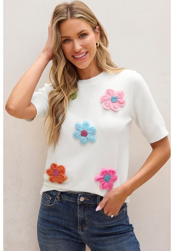 Our styles are designed with a trendy fitted look in mind following an international size standard. For the best fit we suggest choosing one size up from your usual. Be sure to check our sizing chart to find your perfect match!
  Adorable flower applique adds a charming touch
  Short sleeves style for a versatile and stylish look
  Breathable soft and cozy knitwear
  Perfect for layering or wearing on its own
  Available in various sizes to suit your style
  High elasticity for a comfortable fit
Material: 50% Viscose 28% Polyester 22% Polyamide