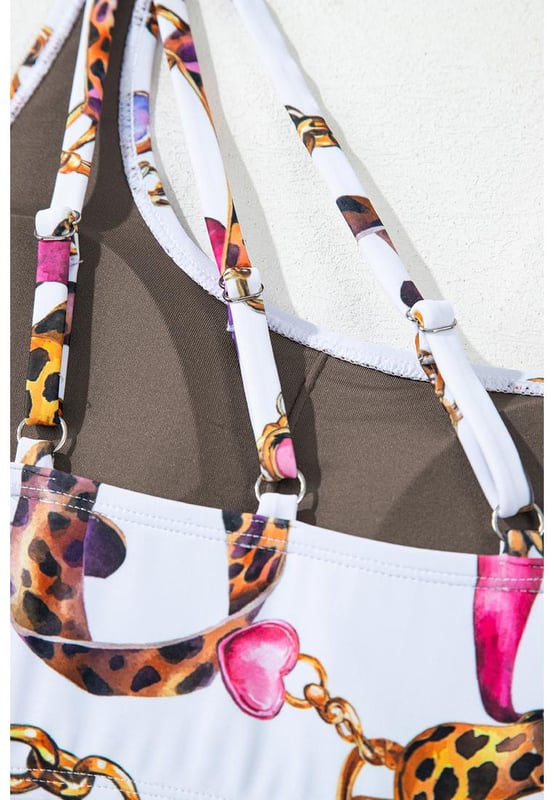 Our styles are designed with a trendy fitted look in mind following an international size standard. For the best fit we suggest choosing one size up from your usual. Be sure to check our sizing chart to find your perfect match!
  Khaki abstract print
  One
  shoulder top
  Ring
  linked design
  High
  waist bikini bottom for tummy control
  Asymmetric look with patchwork bottoms
  Bold patterns for a statement beach look
Material: 82% Polyamide 18% Elastane