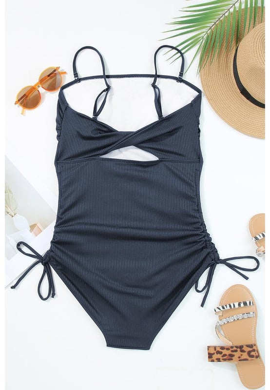 Our styles are designed with a trendy fitted look in mind following an international size standard. For the best fit we suggest choosing one size up from your usual. Be sure to check our sizing chart to find your perfect match!
  Stretchy ribbed knit fabric
  Adjustable spaghetti straps
  Side ruching with drawstring ties
  High cut cheeky bottoms
  Fitted silhouette
Material: 90% Polyester 10% Elastane