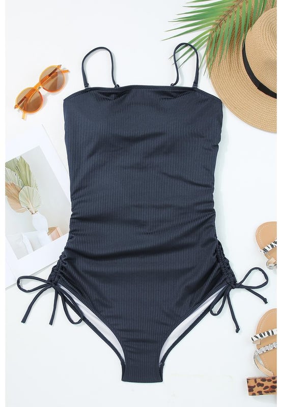 Our styles are designed with a trendy fitted look in mind following an international size standard. For the best fit we suggest choosing one size up from your usual. Be sure to check our sizing chart to find your perfect match!
  Stretchy ribbed knit fabric
  Adjustable spaghetti straps
  Side ruching with drawstring ties
  High cut cheeky bottoms
  Fitted silhouette
Material: 90% Polyester 10% Elastane