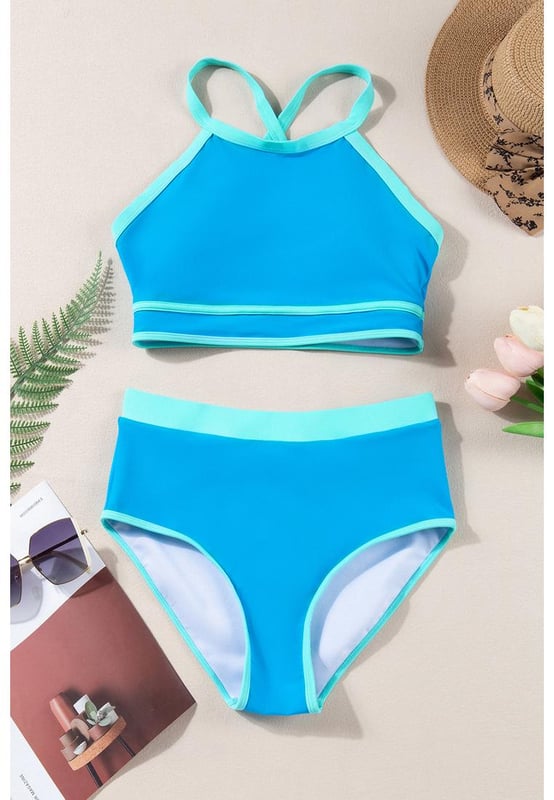 Blue Contrast Trim Crisscross Back High Waisted Bikini
  Eye
  catching contrast trim
  Stylish crisscross back design
  Flattering high
  waisted silhouette
  Comfortable and supportive for all
  day wear
  Perfect for lounging by the pool or beach
Material: 82% Polyamide 18% Elastane