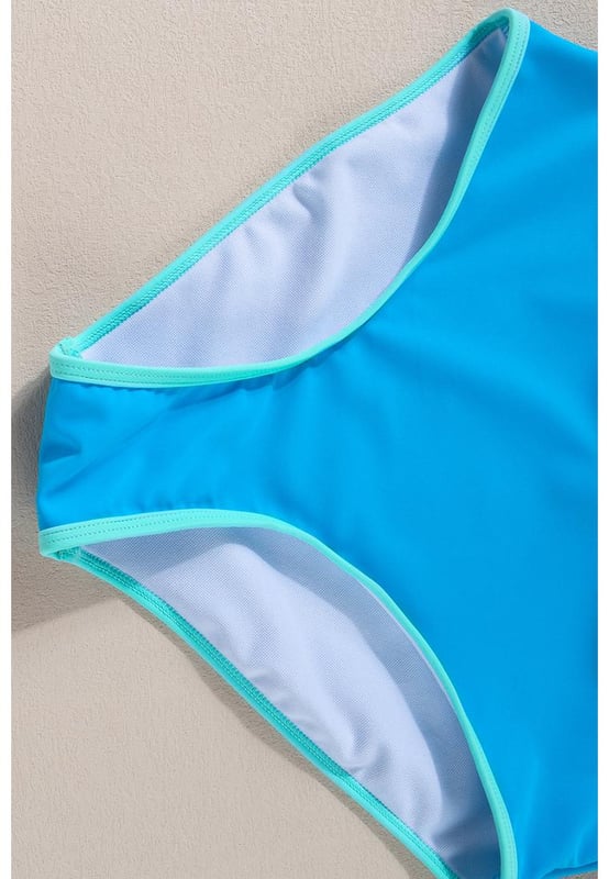 Blue Contrast Trim Crisscross Back High Waisted Bikini
  Eye
  catching contrast trim
  Stylish crisscross back design
  Flattering high
  waisted silhouette
  Comfortable and supportive for all
  day wear
  Perfect for lounging by the pool or beach
Material: 82% Polyamide 18% Elastane