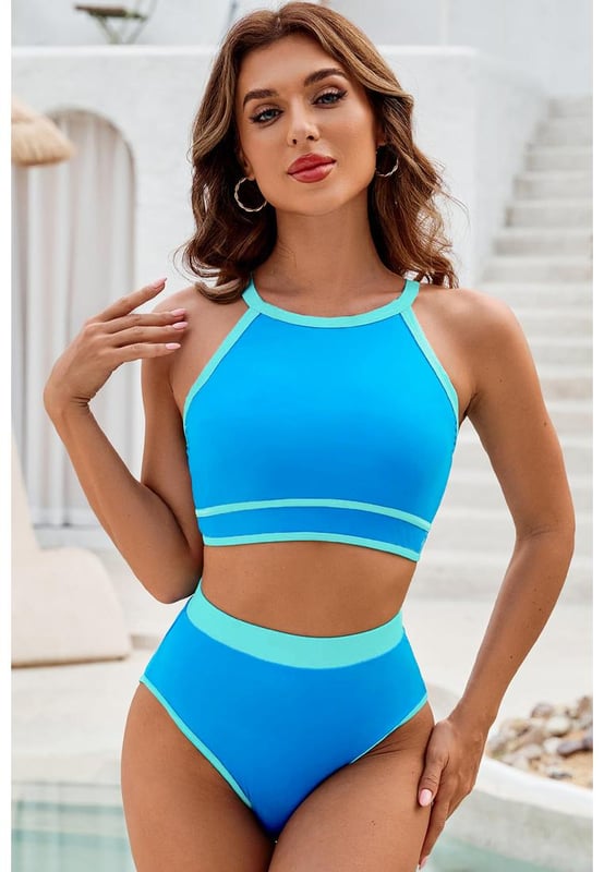 Blue Contrast Trim Crisscross Back High Waisted Bikini
  Eye
  catching contrast trim
  Stylish crisscross back design
  Flattering high
  waisted silhouette
  Comfortable and supportive for all
  day wear
  Perfect for lounging by the pool or beach
Material: 82% Polyamide 18% Elastane