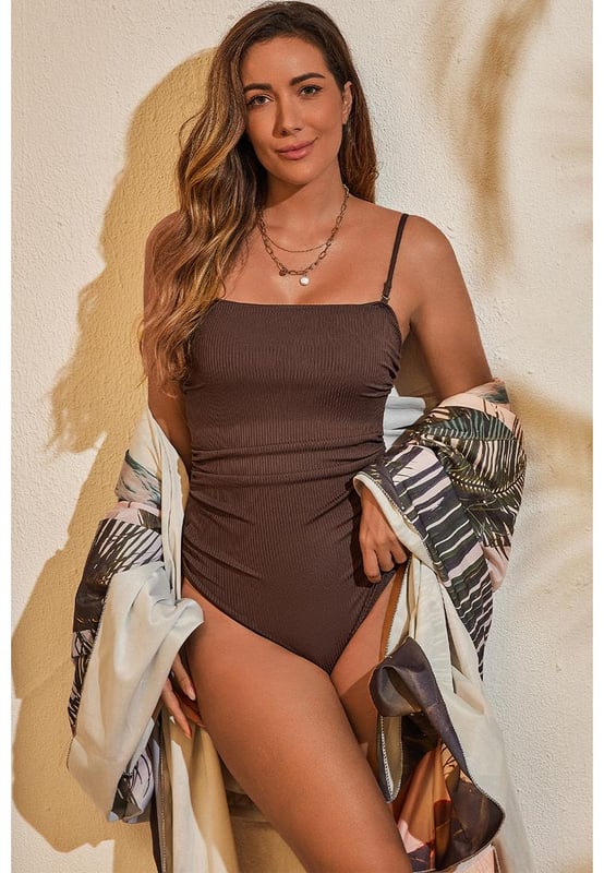 Our styles are designed with a trendy fitted look in mind following an international size standard. For the best fit we suggest choosing one size up from your usual. Be sure to check our sizing chart to find your perfect match!
  Flattering fit with stretchy ribbed knit fabric
  Sexy one
  piece swimwear with adjustable spaghetti straps
  Fitted silhouette with side ruching and drawstring ties
  Accentuates high cut cheeky bottoms
  Ideal for pairing with a beach cover
  up
Material: 90% Polyester 10% Elastane