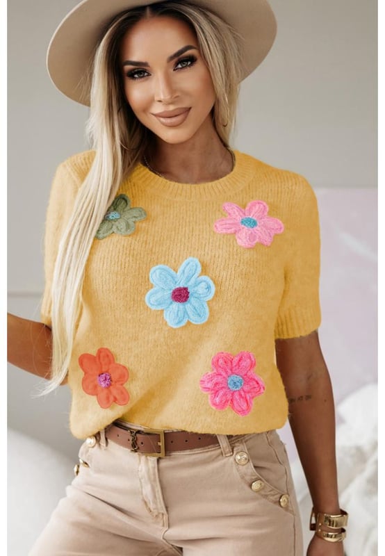 Our styles are designed with a trendy fitted look in mind following an international size standard. For the best fit we suggest choosing one size up from your usual. Be sure to check our sizing chart to find your perfect match!
  Adorable flower applique for a charming touch
  Short sleeves for a versatile and stylish look
  Breathable soft and cozy knitwear
  Perfect for layering or wearing on its own
  Available in various designs
Material: 50% Viscose 28% Polyester 22% Polyamide