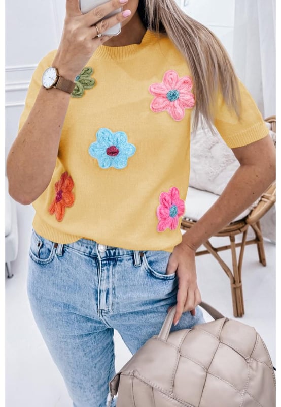 Our styles are designed with a trendy fitted look in mind following an international size standard. For the best fit we suggest choosing one size up from your usual. Be sure to check our sizing chart to find your perfect match!
  Adorable flower applique for a charming touch
  Short sleeves for a versatile and stylish look
  Breathable soft and cozy knitwear
  Perfect for layering or wearing on its own
  Available in various designs
Material: 50% Viscose 28% Polyester 22% Polyamide