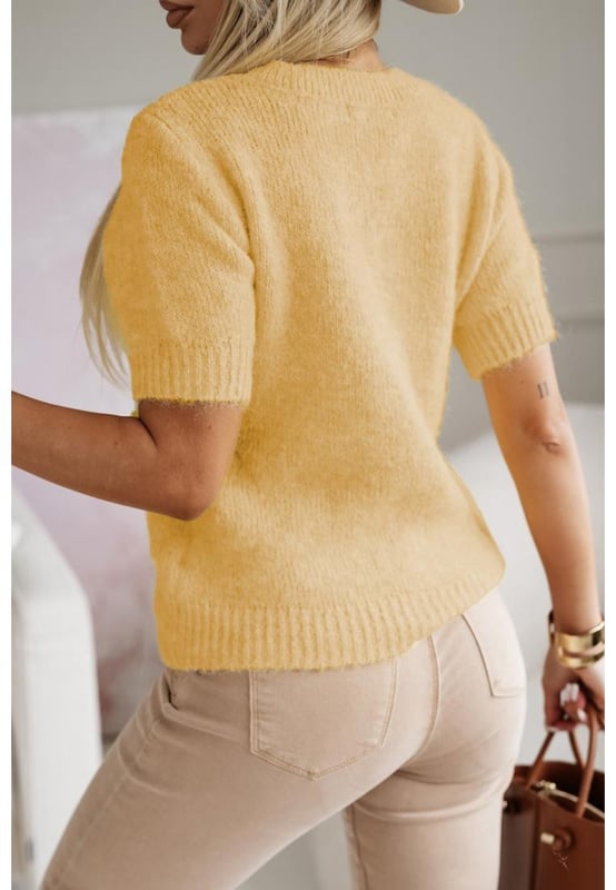 Our styles are designed with a trendy fitted look in mind following an international size standard. For the best fit we suggest choosing one size up from your usual. Be sure to check our sizing chart to find your perfect match!
  Adorable flower applique for a charming touch
  Short sleeves for a versatile and stylish look
  Breathable soft and cozy knitwear
  Perfect for layering or wearing on its own
  Available in various designs
Material: 50% Viscose 28% Polyester 22% Polyamide