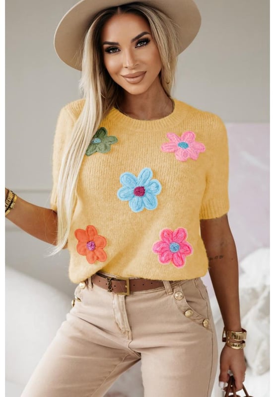 Our styles are designed with a trendy fitted look in mind following an international size standard. For the best fit we suggest choosing one size up from your usual. Be sure to check our sizing chart to find your perfect match!
  Adorable flower applique for a charming touch
  Short sleeves for a versatile and stylish look
  Breathable soft and cozy knitwear
  Perfect for layering or wearing on its own
  Available in various designs
Material: 50% Viscose 28% Polyester 22% Polyamide