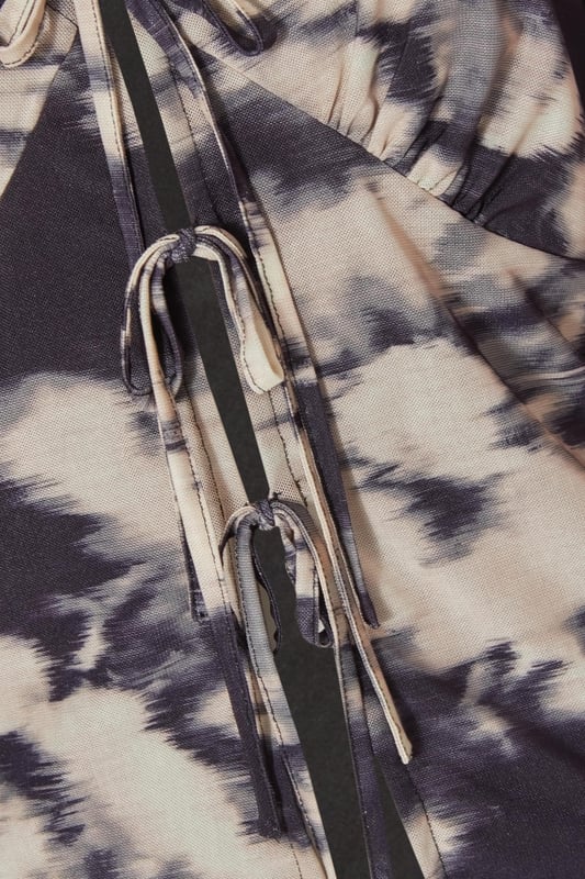 - Mesh finish - Marble print - Tie front - Balloon sleeves - Model height: 5'6" - Model wears uk 8 / us 4 / eur 36 - Always check the wash care label - Cool hand wash with mild detergent