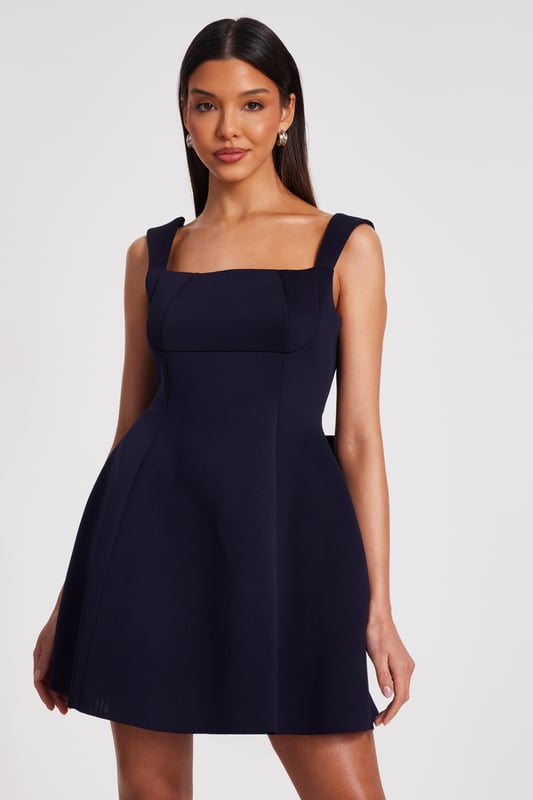 - Bow detail - Square neck - Low back - Skater style - Model height: 5'9" - Model wears uk 8 / us 4 / eur 36 - Always check the wash care label - Cool hand wash with mild detergent