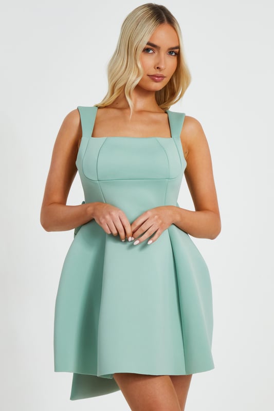 - Large bow detail - Skater style - Square neck - Mini length - Model height: 5'7" - Model wears uk 8 / us 4 / eur 36 - Always check the wash care label - Cool hand wash with mild detergent