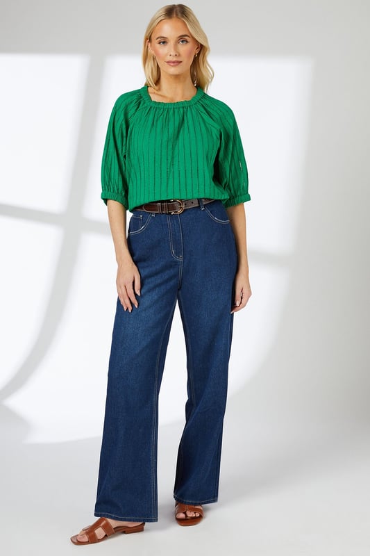 Elasticated neckline for a comfortable, gathered look
        Striking vertical stripe pattern adds visual interest
        Three-quarter length sleeves with subtle balloon shape
        Relaxed fit through the body for easy movement
        Versatile length suitable for tucking or wearing loose
    
    This charming blouse from Principles presents a perfect blend of comfort and style for your casual wardrobe. The elasticated neckline creates a soft, gathered effect that frames the face beautifully, while the vertical stripe pattern elongates the silhouette. The three-quarter length sleeves feature a subtle balloon shape, adding a touch of femininity to the overall design. For a chic daytime look, pair this blouse with wide-leg jeans and sandals, as shown in the image. Add a woven belt to cinch the waist and create definition. This versatile top is ideal for family gatherings, weekend brunches, or casual office days. Layer with a cardigan for cooler weather or wear on its own for a breezy, effortless style. The cotton fabric ensures breathability and ease of care, making this blouse a practical yet fashionable choice for your everyday rotation.