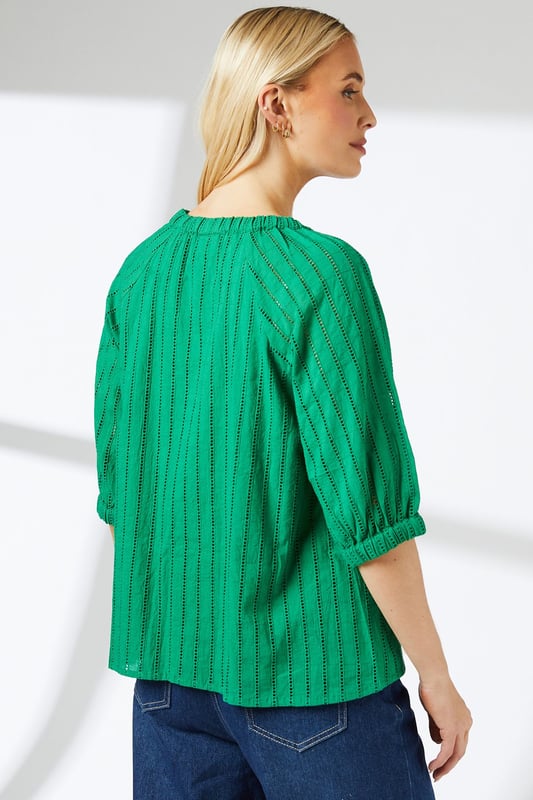 Elasticated neckline for a comfortable, gathered look
        Striking vertical stripe pattern adds visual interest
        Three-quarter length sleeves with subtle balloon shape
        Relaxed fit through the body for easy movement
        Versatile length suitable for tucking or wearing loose
    
    This charming blouse from Principles presents a perfect blend of comfort and style for your casual wardrobe. The elasticated neckline creates a soft, gathered effect that frames the face beautifully, while the vertical stripe pattern elongates the silhouette. The three-quarter length sleeves feature a subtle balloon shape, adding a touch of femininity to the overall design. For a chic daytime look, pair this blouse with wide-leg jeans and sandals, as shown in the image. Add a woven belt to cinch the waist and create definition. This versatile top is ideal for family gatherings, weekend brunches, or casual office days. Layer with a cardigan for cooler weather or wear on its own for a breezy, effortless style. The cotton fabric ensures breathability and ease of care, making this blouse a practical yet fashionable choice for your everyday rotation.