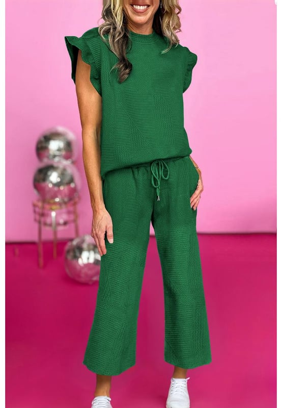 Our styles are designed with a trendy fitted look in mind following an international size standard. For the best fit we suggest choosing one size up from your usual. Be sure to check our sizing chart to find your perfect match!
  Dark green two
  piece set
  Includes ruffled sleeve summer top and cropped loose pants
  Crew neck top with feminine ruffled sleeves
  Cropped pants with adjustable drawstring waistline
  Made from textured fabric
  Ideal for summer outings
Material: 97% Polyester 3% Elastane