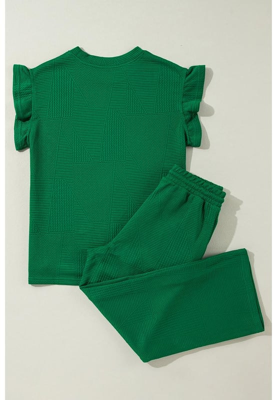 Our styles are designed with a trendy fitted look in mind following an international size standard. For the best fit we suggest choosing one size up from your usual. Be sure to check our sizing chart to find your perfect match!
  Dark green two
  piece set
  Includes ruffled sleeve summer top and cropped loose pants
  Crew neck top with feminine ruffled sleeves
  Cropped pants with adjustable drawstring waistline
  Made from textured fabric
  Ideal for summer outings
Material: 97% Polyester 3% Elastane