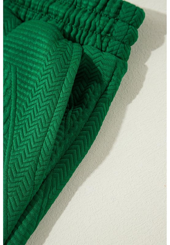 Our styles are designed with a trendy fitted look in mind following an international size standard. For the best fit we suggest choosing one size up from your usual. Be sure to check our sizing chart to find your perfect match!
  Dark green two
  piece set
  Includes ruffled sleeve summer top and cropped loose pants
  Crew neck top with feminine ruffled sleeves
  Cropped pants with adjustable drawstring waistline
  Made from textured fabric
  Ideal for summer outings
Material: 97% Polyester 3% Elastane