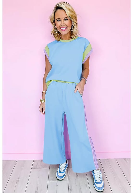 Our styles are designed with a trendy fitted look in mind following an international size standard. For the best fit we suggest choosing one size up from your usual. Be sure to check our sizing chart to find your perfect match!
  Sky Blue Color Block Detail Casual Two
  piece Outfit
  Crew neck cap sleeve tee
  Crop wide leg pants
  Eye
  catching colorblock detail
  Loose fit adaptable to most body shapes
  Made from fine fabric for warm weather
Material: 95% Polyester 5% Elastane