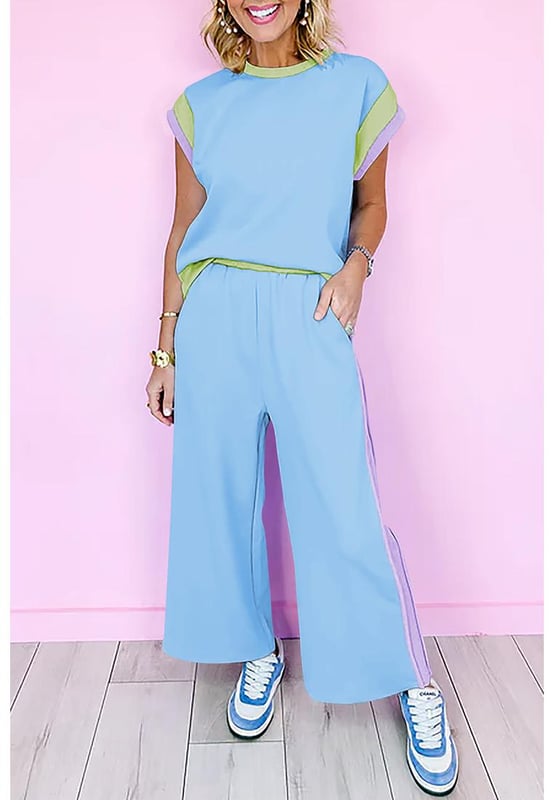 Our styles are designed with a trendy fitted look in mind following an international size standard. For the best fit we suggest choosing one size up from your usual. Be sure to check our sizing chart to find your perfect match!
  Sky Blue Color Block Detail Casual Two
  piece Outfit
  Crew neck cap sleeve tee
  Crop wide leg pants
  Eye
  catching colorblock detail
  Loose fit adaptable to most body shapes
  Made from fine fabric for warm weather
Material: 95% Polyester 5% Elastane