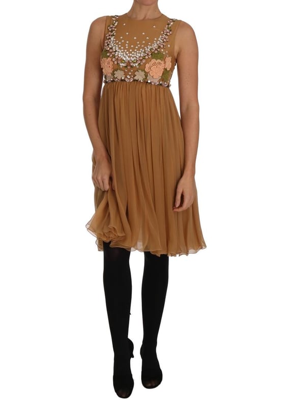 Dolce & Gabbana Exclusive Masterpiece Dress
  Brand new with tags
  100% Authentic
  Above knee
  length A
  line silhouette
  Color: Gold
  Crystals: Clear and pink
  Multicolor floral Ricamo applique
  Back zipper closure
  Silk blend inner lining
  Logo details
  Made in Italy
Material: 100% SILK