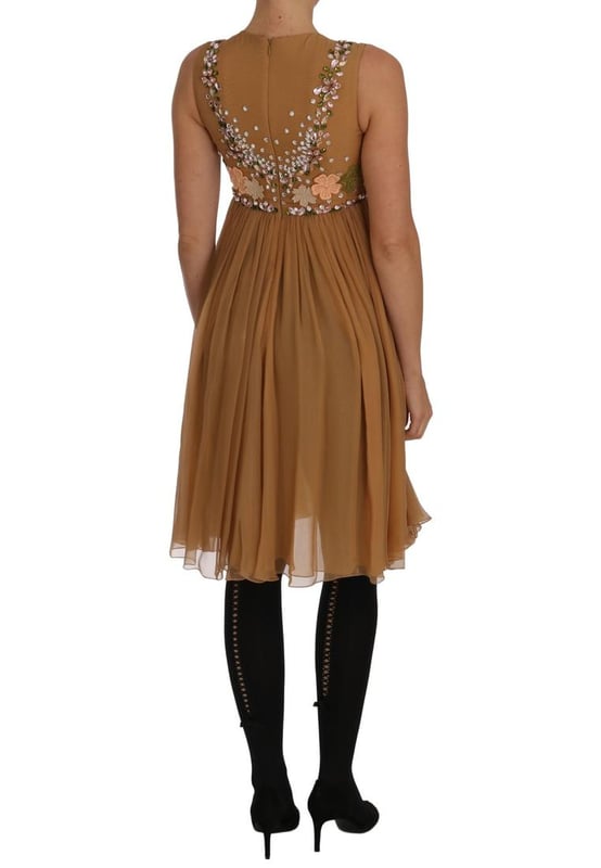 Dolce & Gabbana Exclusive Masterpiece Dress
  Brand new with tags
  100% Authentic
  Above knee
  length A
  line silhouette
  Color: Gold
  Crystals: Clear and pink
  Multicolor floral Ricamo applique
  Back zipper closure
  Silk blend inner lining
  Logo details
  Made in Italy
Material: 100% SILK