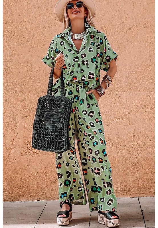 Green Leopard Print Short Sleeve Shirt and Wide Leg Pants Set
  Coordinated two
  piece set with mix
  and
  match possibilities
  Trendy leopard print for a bold and stylish touch
  Short sleeve shirt keeps you cool and chic
  Wide leg pants offer a trendy and flattering silhouette
Material: 100% Polyester