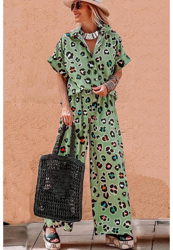 Green Leopard Print Short Sleeve Shirt and Wide Leg Pants Set
  Coordinated two
  piece set with mix
  and
  match possibilities
  Trendy leopard print for a bold and stylish touch
  Short sleeve shirt keeps you cool and chic
  Wide leg pants offer a trendy and flattering silhouette
Material: 100% Polyester
